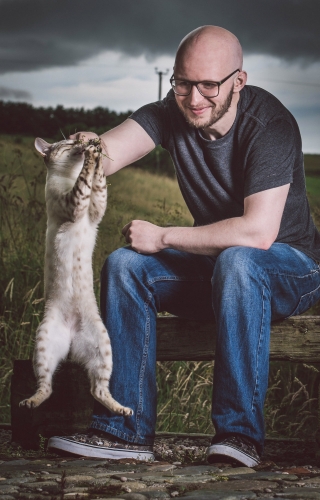 A photo of  Aberdeen based wedding photographer Jonathan Addie with his cat